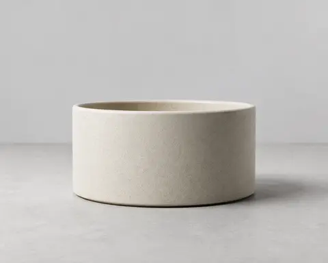 Minh họa cho “Hình học”: a matte ceramic vessel with a low cylindrical body.