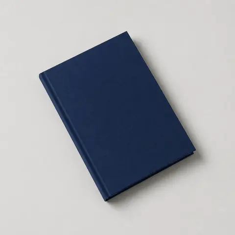 Minh họa cho “Hướng vật thể”: a closed book tilted 30 degrees counterclockwise toward the left on the table.
