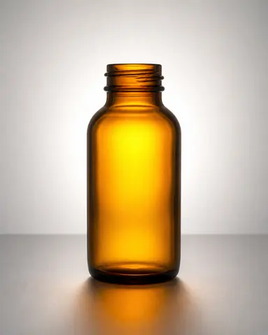Minh họa cho “Độ xuyên sáng”: a translucent amber glass bottle glowing under backlight.